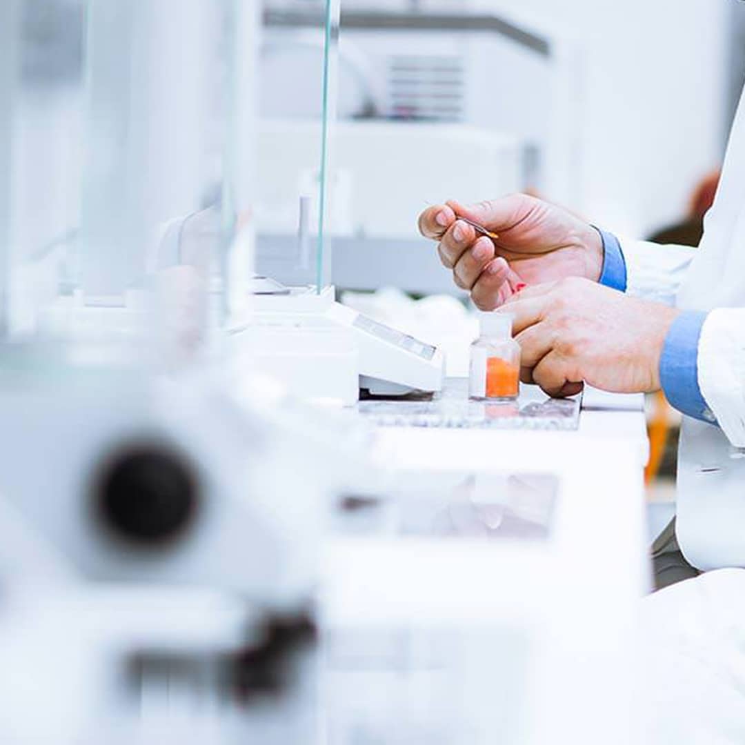 Latest Publications – hands of a lab worker